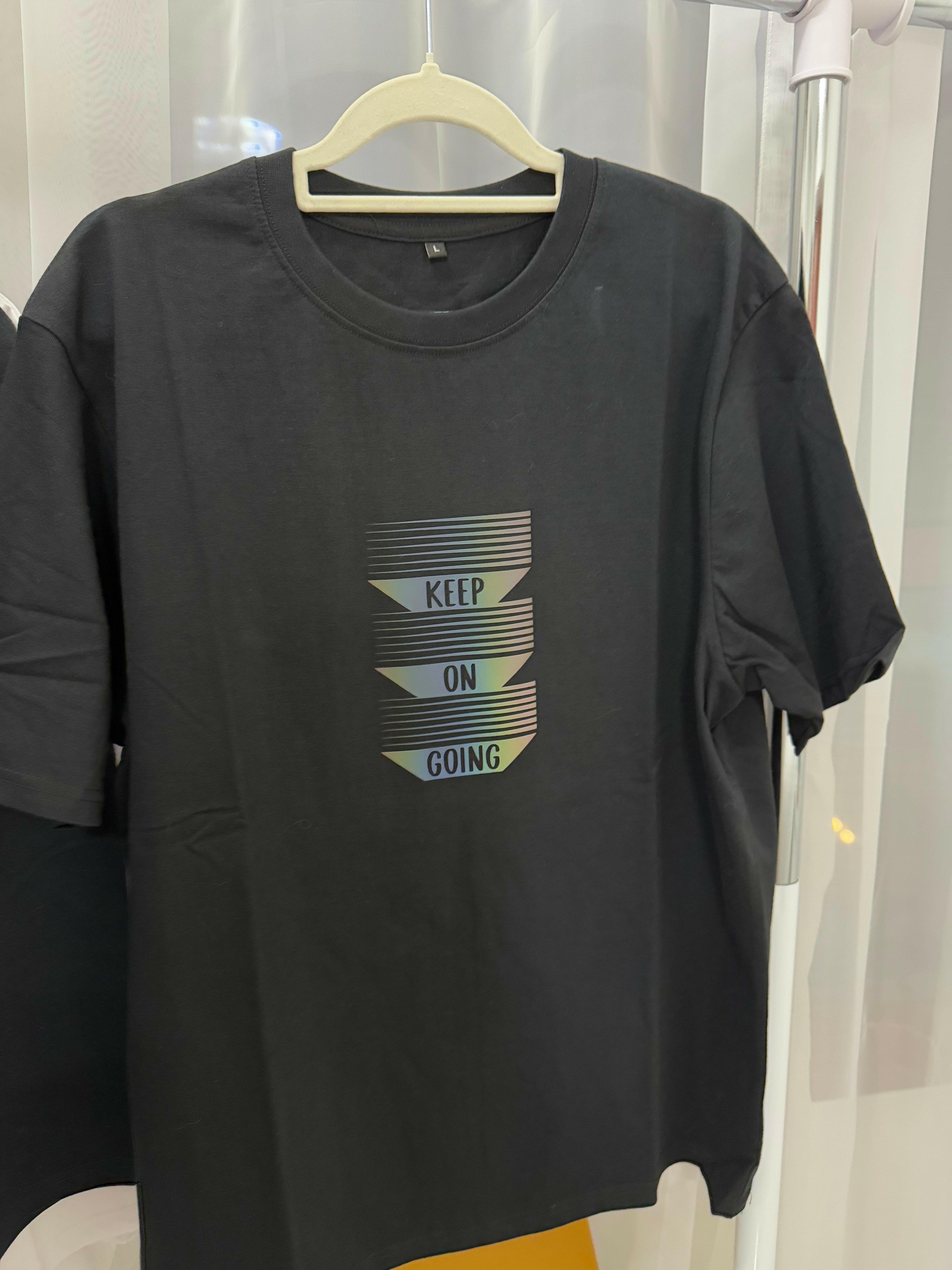 Black cotton t-shirt with reflective matte graphic saying &