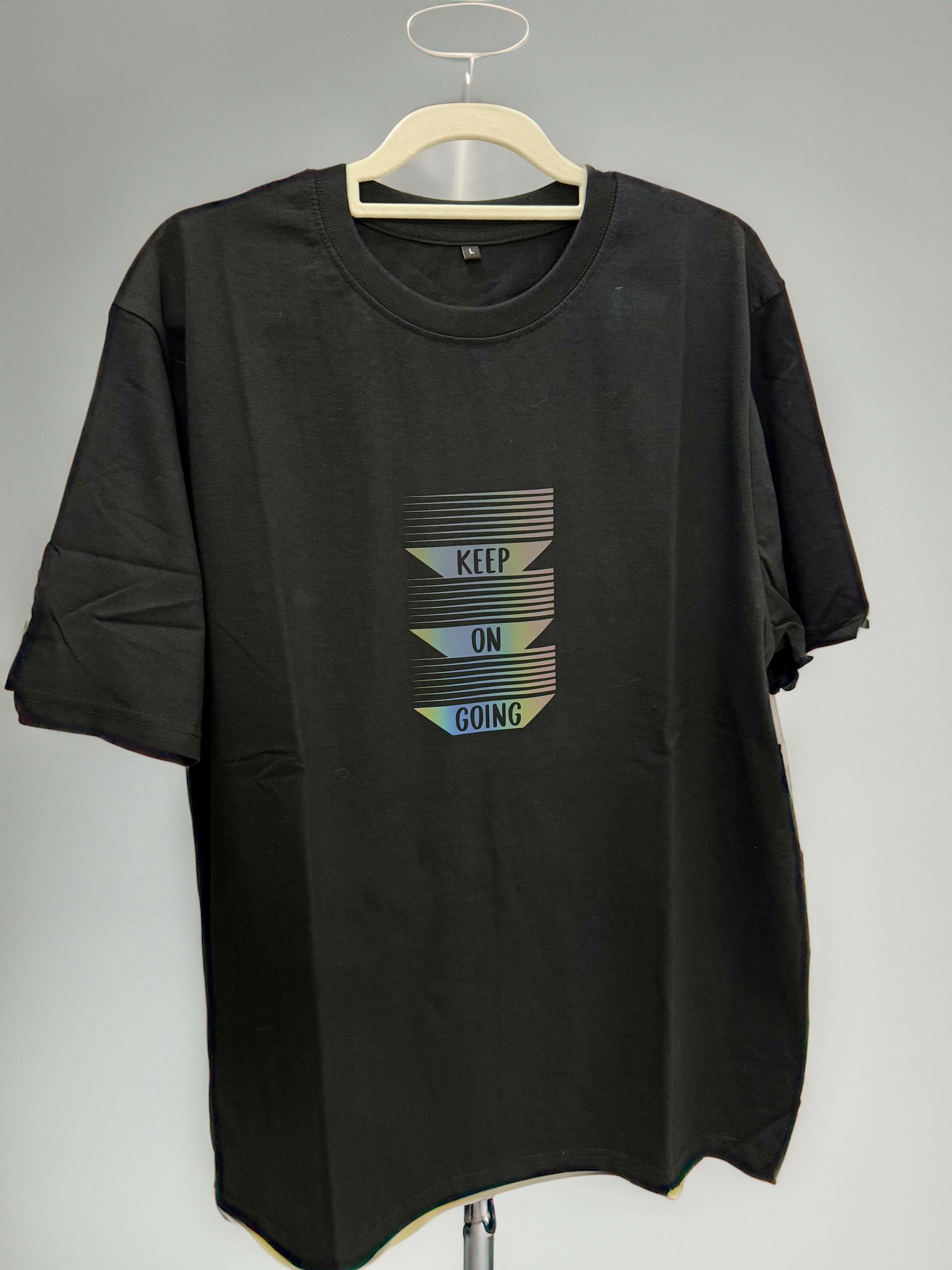 Keep Going cotton t-shirt with reflective matte graphic, stylish and functional for spring/summer.