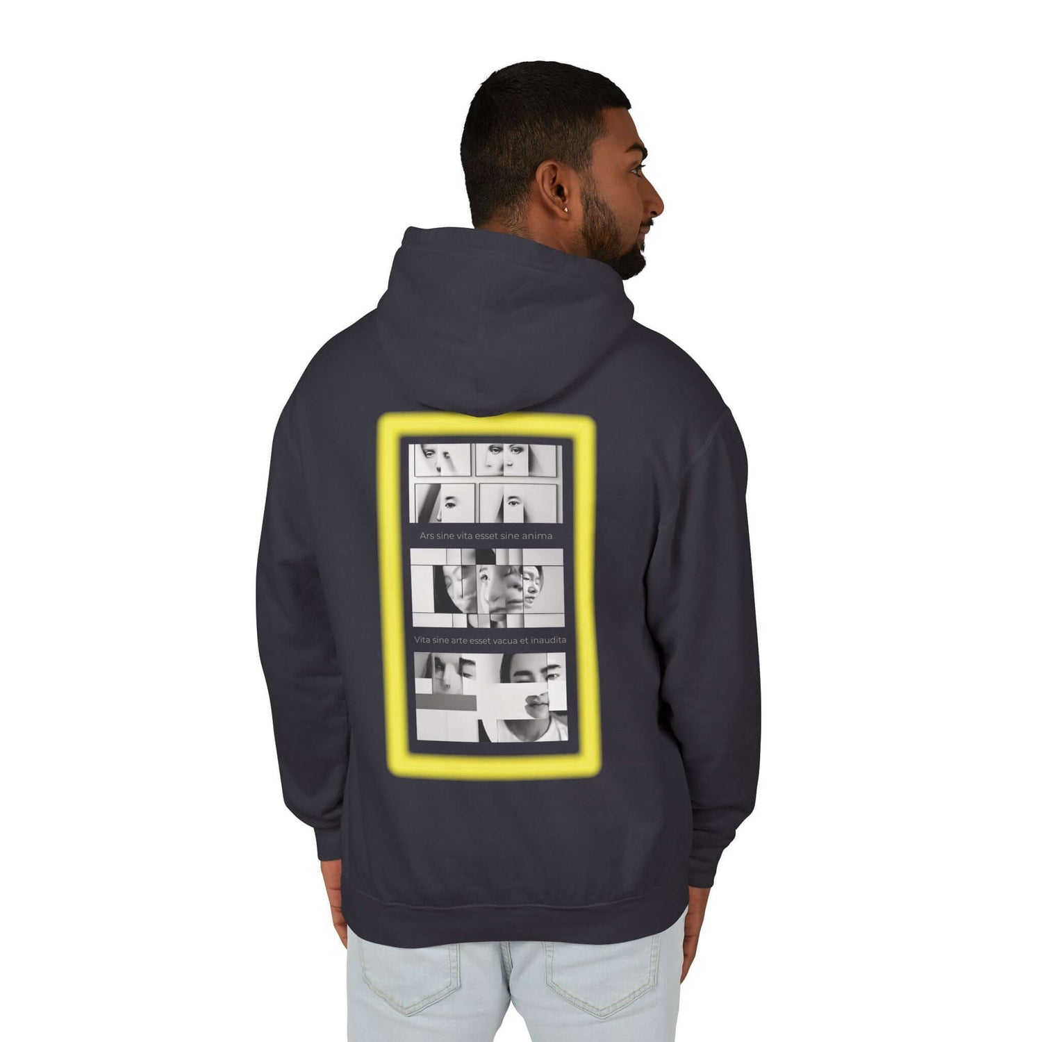 Man wearing a stylish dark hoodie with a bold graphic print on the back, perfect for casual wear.