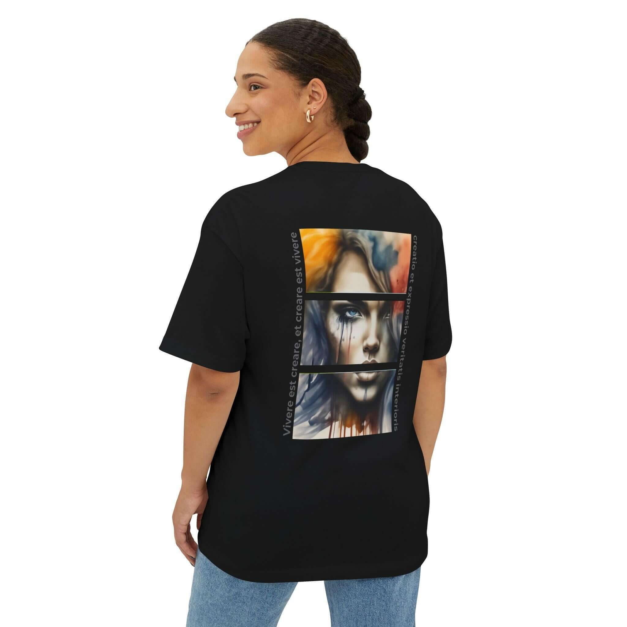 Unisex oversized black tee featuring artistic design on back, showcasing a vibrant portrait and modern style.