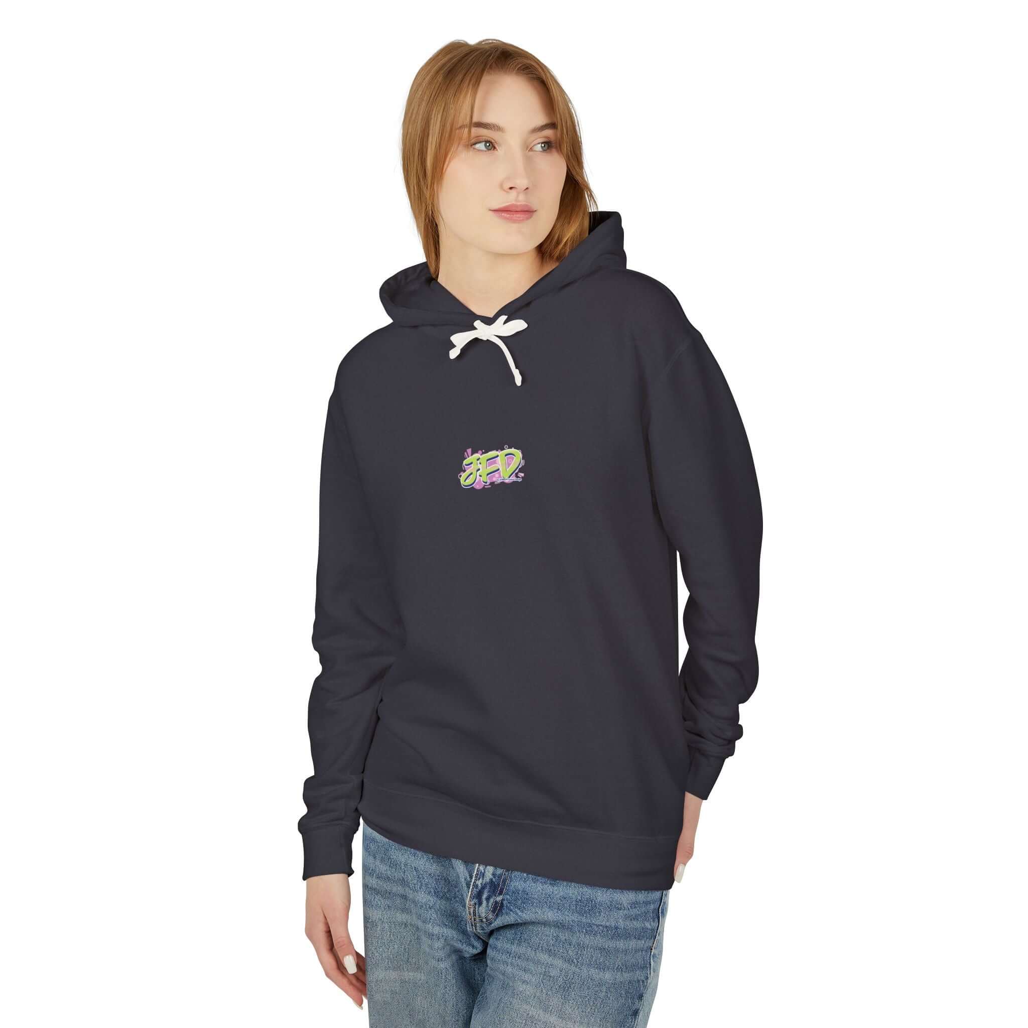 Woman wearing an artistic unisex lightweight hooded sweatshirt in dark color with stylish front design.