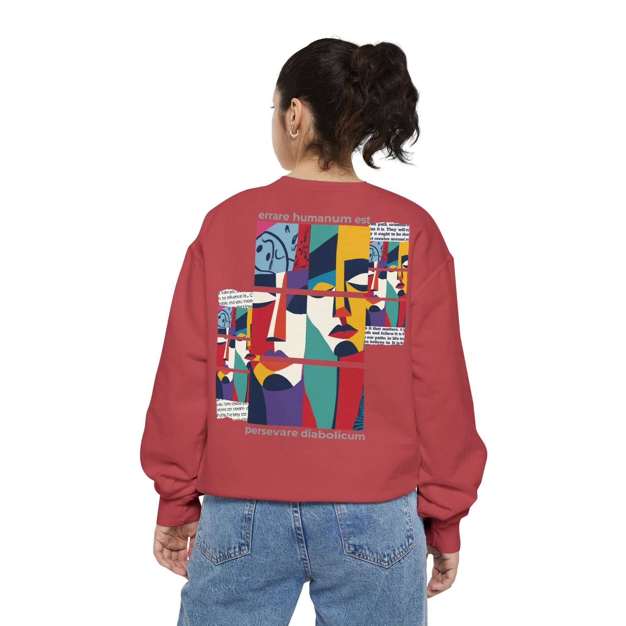 Unisex garment-dyed sweatshirt with colorful motivational design and artistic patterns on the back, perfect for casual wear.