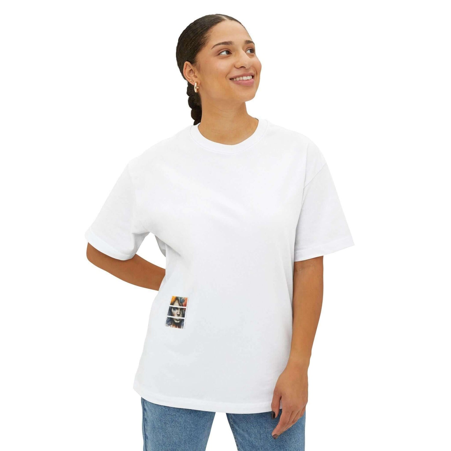 Model wearing a stylish white unisex oversized tee featuring an artistic design, perfect for casual outings and comfort.