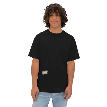 Unisex oversized black tee featuring artistic design, modeled by a young person with curly hair. Perfect for casual wear.