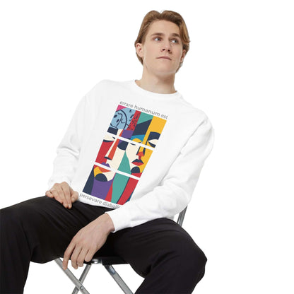 Young man wearing a colorful motivational unisex sweatshirt with artistic design, showcasing comfort and style.