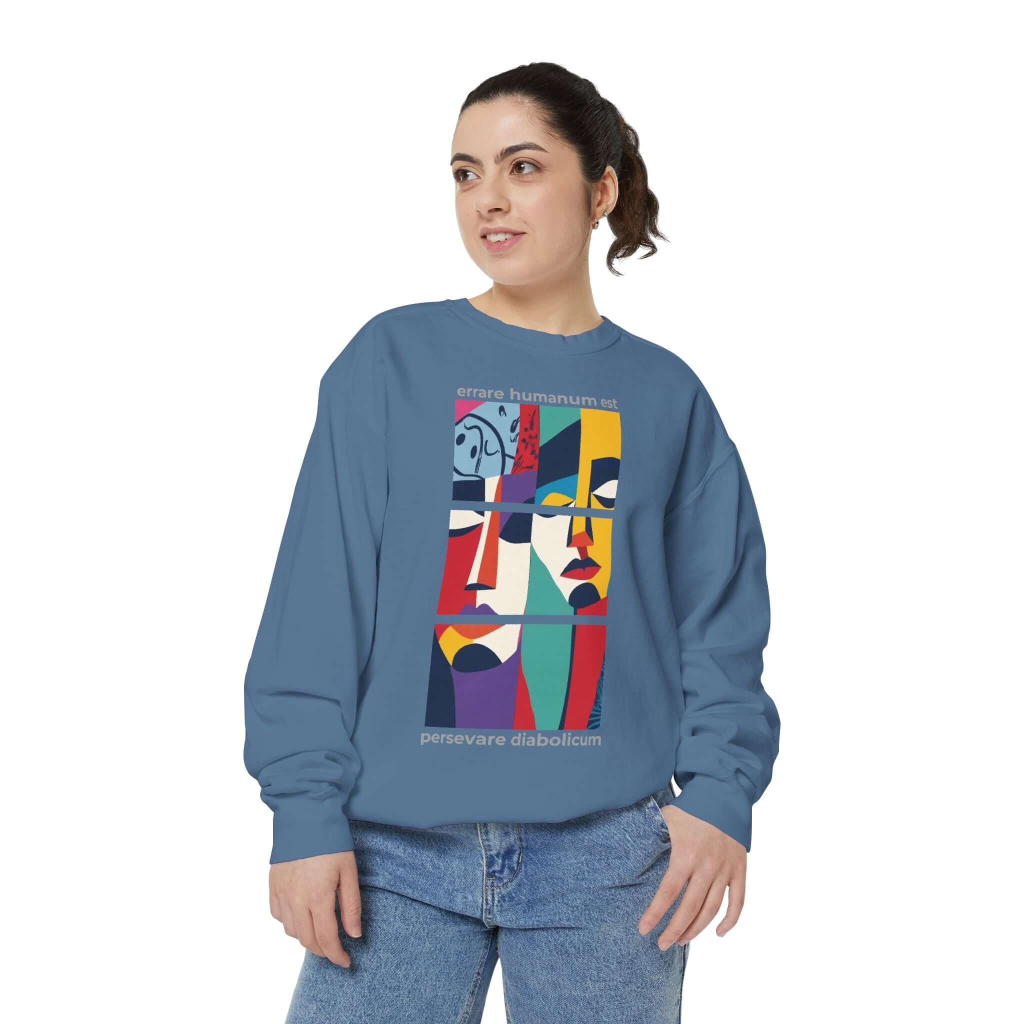 Colorful unisex sweatshirt with abstract design featuring faces, perfect for stylish comfort and self-expression.