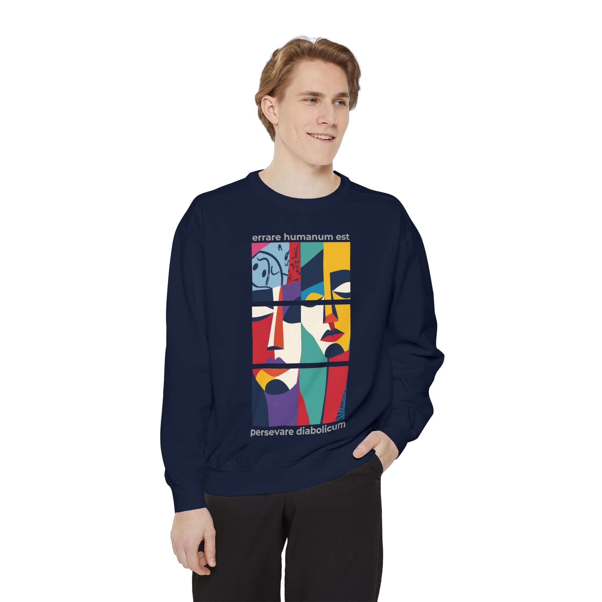 Colorful unisex sweatshirt featuring artistic face designs on a navy background, perfect for stylish comfort.